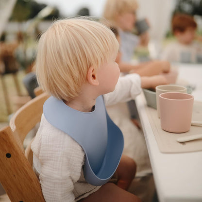 mushie Silicone Baby Bib | Adjustable Fit Waterproof Bibs (Dusty Rose)